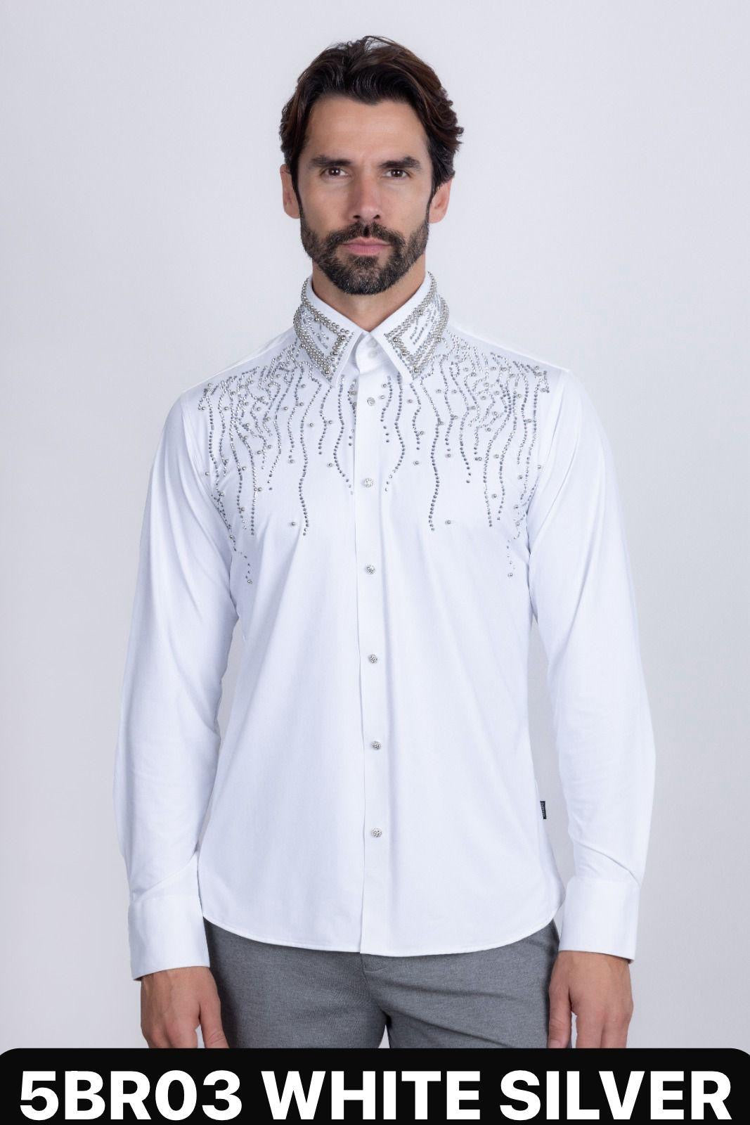 Man wearing a white shirt with silver embroidery on a plain background
