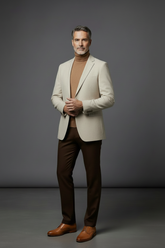 Cream blazer with light brown turtleneck, brown pants and camel shoes