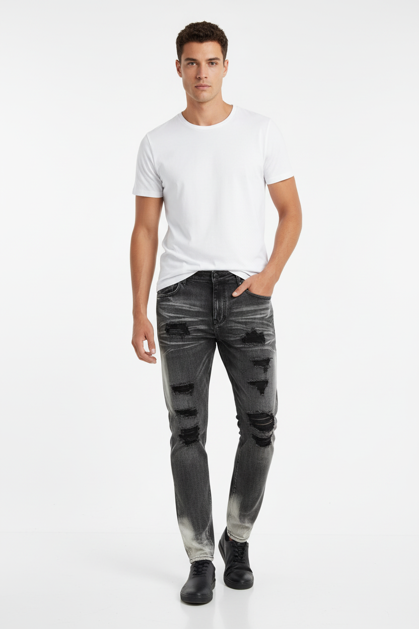 Male model wearing distressed jeans and white t-shirt