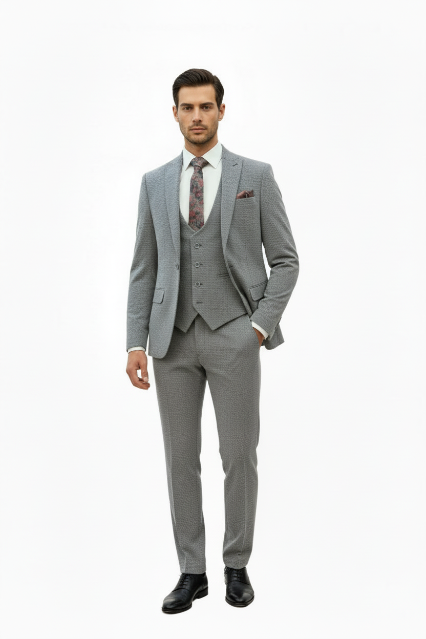 A 3-piece gray suit on a mannequin, including a blazer, trousers, and a tie with a floral pattern.