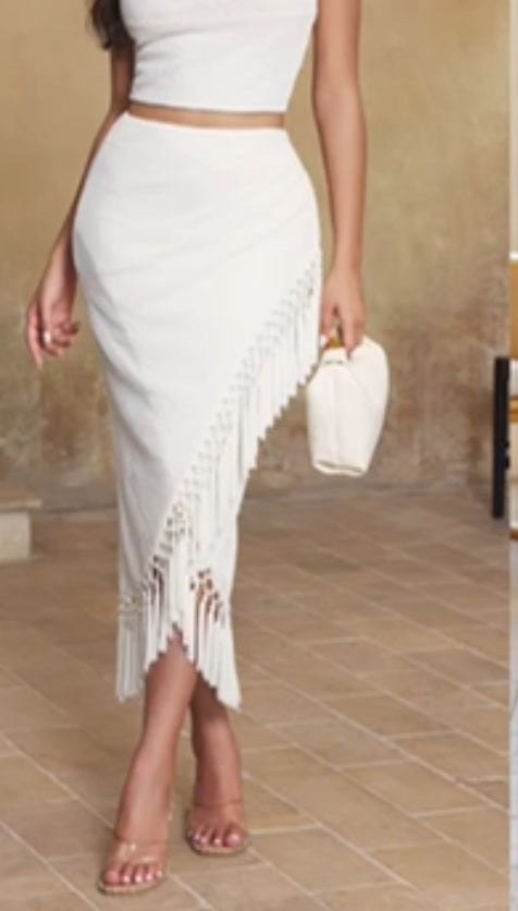 Sleek and modern monochromatic ensemble with a touch of boho chic