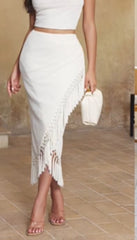 Sleek and modern monochromatic ensemble with a touch of boho chic