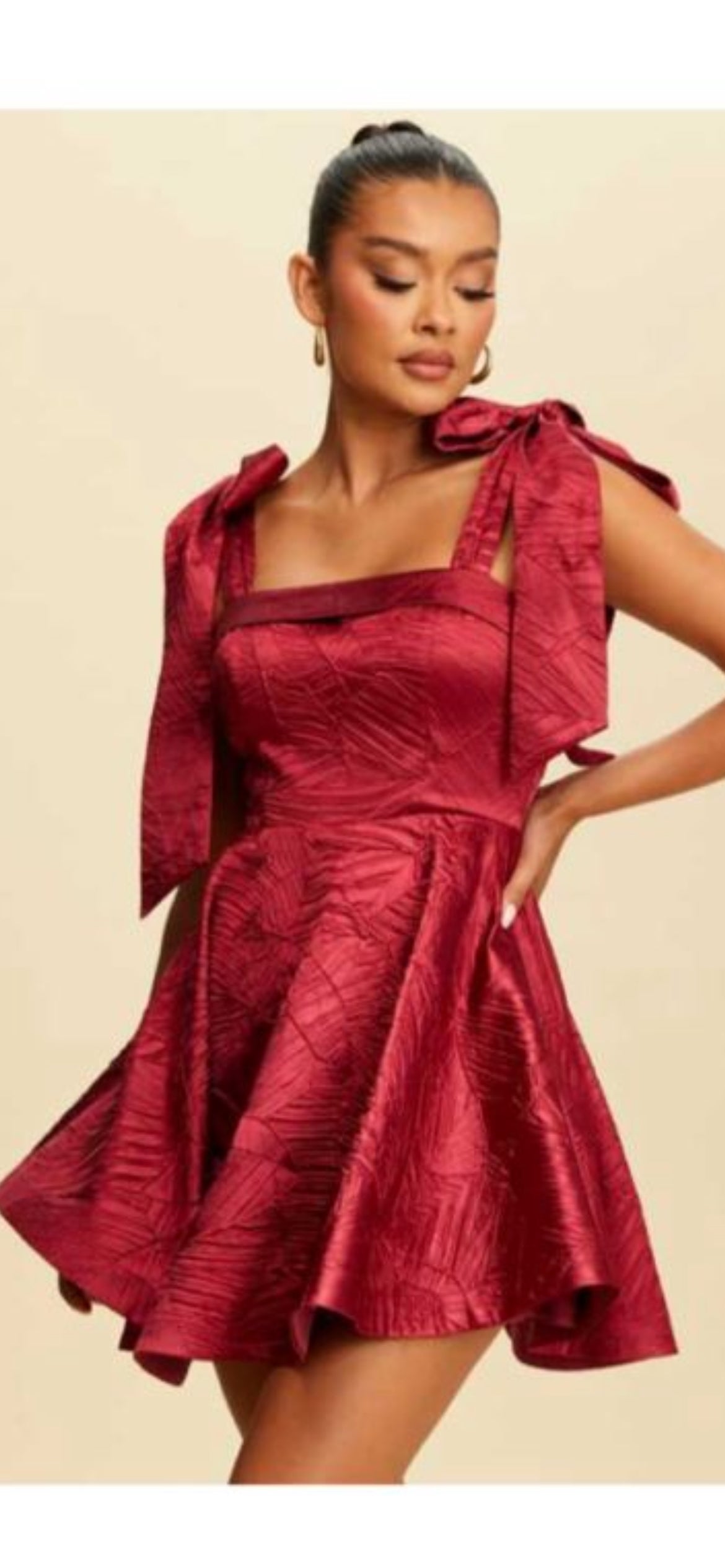 FLARED MINI DRESS WITH DRAMATIC BOWS
